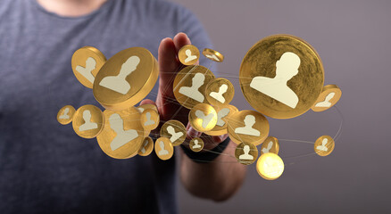 Connecting people, digital social network concept. Golden profile icons linked above person's hand....