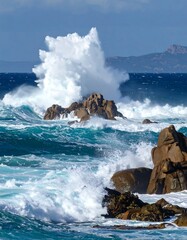 Dramatic ocean waves crashing against rocks