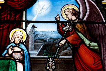 Saint Seine church.  Stained glass. The Annunciation by the angel Gabriel to the Virgin Mary. Corbigny. France.