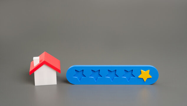 One star near a house representing a negative review, poor rating, or low customer satisfaction in real estate, property services, or online feedback. Real estate, hotel