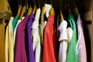 Sunday mass in a catholic parish.  Priests' chasubles in the sacristy. Bonneville. France.