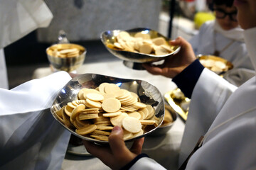 Sunday mass in a catholic parish.  Hosts for communion. Bonneville. France.