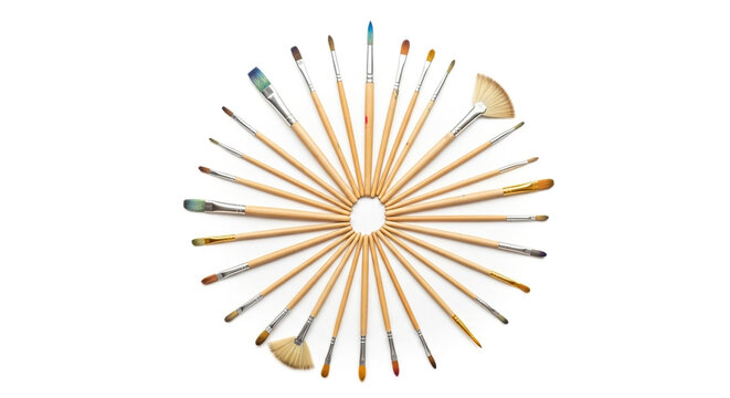 Circular arrangement of assorted paintbrushes isolated on white background, showcasing a variety of sizes and shapes for artistic endeavors