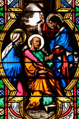 Obraz premium Church of the Cordeliers. Stained glass. The death of Saint Joseph surrounded by the Blessed Virgin and Jesus. Lons le Saunier. France.