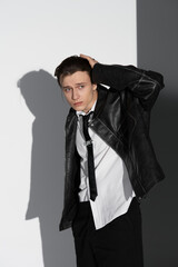 Stylish young man showcasing youth culture in a modern urban setting with bold fashion choices