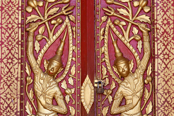 Wat Phramahathat Rajbovoravihane buddhist temple.  Door decorated.  Luang Prabang. Laos.