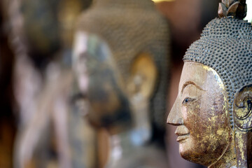 Wat Visounnarath buddhist temple. Wooden Buddha ( calling for the rain position ).  17 th - 18 th...
