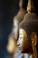 Wat Visounnarath buddhist temple. Wooden Buddha ( calling for the rain position ).  17 th - 18 th century. Wood, lacquer, gold leaf.  Luang Prabang. Laos. © Godong Photo