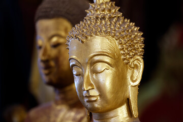 Wat May Souvannapoumaram temple. Main altar. Golden Buddha statues.  Luang Prabang. Laos.