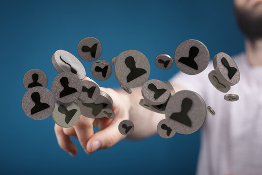 Man interacting with social network icons representing virtual connections and communication in a digital age. 142 chars.