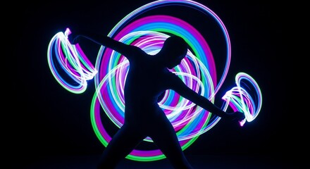 Silhouette performer glowing with colorful light trails in dark background, creative illumination shines around flow arts dancer. Evocative glow art showcases artistic expression and movement.