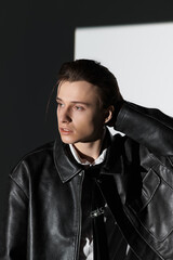 Obraz premium Stylish teen showcasing modern youth culture in urban setting with a confident look
