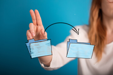 Hand moving files, data transfer, cloud storage, online sharing, digital organization, efficient...