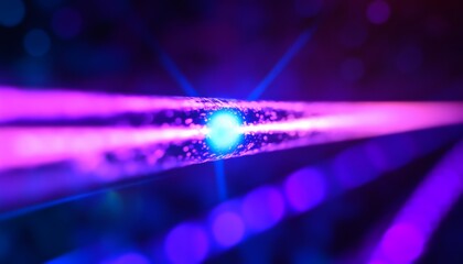 The image shows a close-up of a glowing tube, emitting bright blue and magenta light, with a bokeh effect in the background.