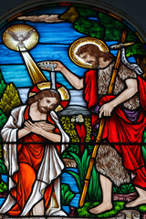 Stained glass. The baptism of Jesus by John the Baptist.  Church of Fatima.  Ho Chi Minh city. Vietnam.