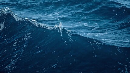 Deep blue ocean water with gentle waves and light reflections