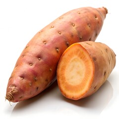 Two sweet potatoes one cut revealing orange flesh on white