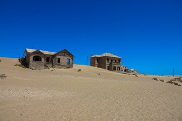 Kolmanskop, a ghost town in Namibia. Dilapidated and long-abandoned houses.
Today, the sands of the...