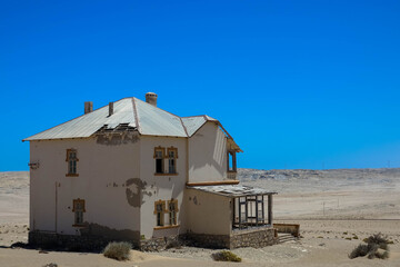 Kolmanskop, a ghost town in Namibia. Dilapidated and long-abandoned houses.
Today, the sands of the...