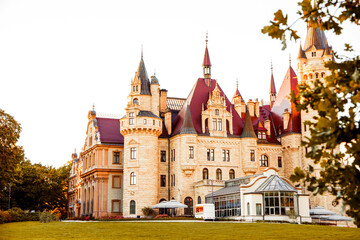 Old stone fortress surrounded by nature and sunlight, evoking a magical medieval atmosphere.