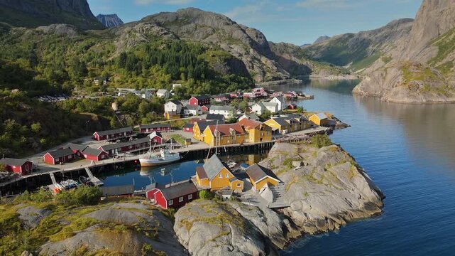 Aerial shot of famous Nusfjord fishing villgae, Lofoten Islands, Norway. Discover the stunning coastal village with colorful houses nestled between mountains and water in northern Norway