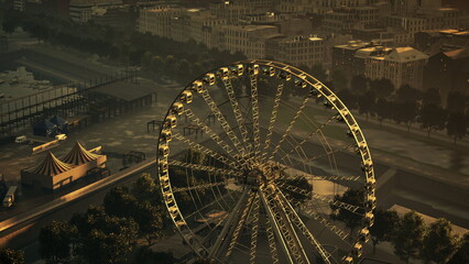 Golden hues illuminate the sky as the Ferris wheel spins gently. The cityscape in the background showcases buildings and a carnival tent, creating a festive atmosphere at dusk.