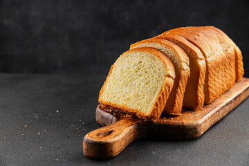 Brioche bread slices bakery pastry natural product tasty snack fresh delicious gourmet food background on the table rustic top view copy space