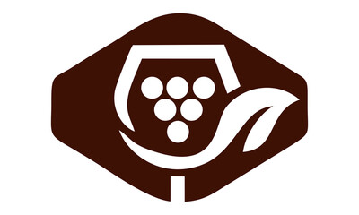 a string of leaves with a glass containing grapes