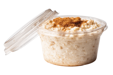 Overnight oats in a clear plastic cup with a lid, sprinkled with brown sugar and cinnamon, isolated on transparent background