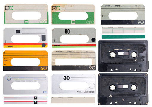 Collection of different paper labels for vintage music cassette audio tapes isolated on transparent background. The labels show signs of wear and have a lot of grunge stains and scratches. 