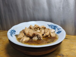 A delicious side dish consisting of boneless chicken pieces with sweet sauce. Ready-to-serve dish for product photos and culinary business advertisements. Close-up. Text space. Selective focus.