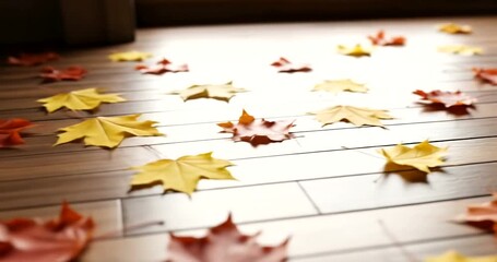 Fallen autumn leaves in warm colors scatter across a wooden surface. - Powered by Adobe