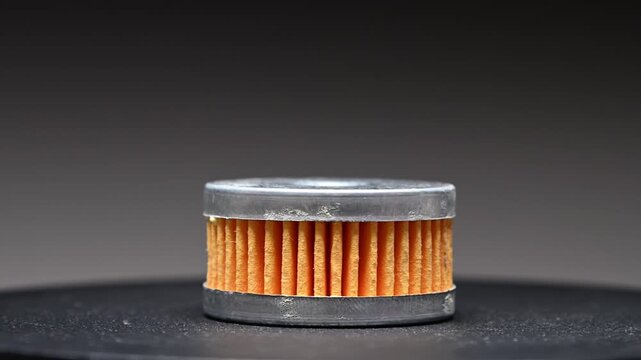 A new LPG filter for the gas reducer of an automotive gas fuel system. Rotating on a gray gradient background.