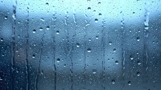 Rain Drops on Window Glass Background &ndash; Blue Rain Texture Loop