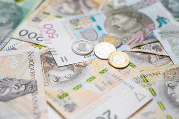 Close-up view of Polish zloty coins and notes representing national currency, economy, and savings. Perfect background for finance, taxation, investment designs related to Poland or European markets