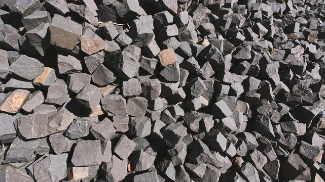 A pile of crushed basalt rock pieces.