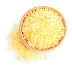 Yellow sea salt in bowl isolated on white, top view