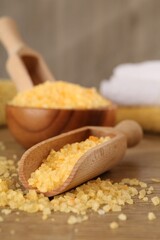 Natural sea salt on wooden table, closeup