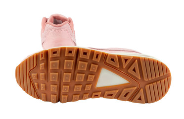 Pair of fashionable pink leather sneakers, isolated on a transparent background with one sneaker showing its sole. 