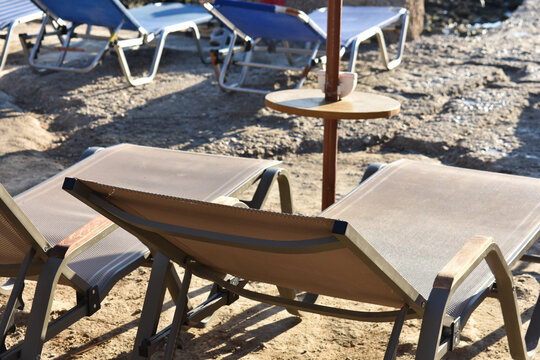 Ladiko Bay on Rhodes Island, Greece. Holidays in Greece. Travel to Rhodes. Beach umbrella. Summer and holidays. Umbrella and sunbeds on a beach in Greece. 
