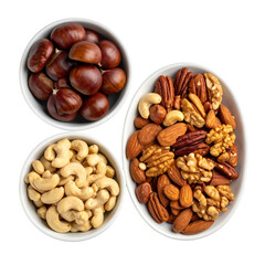 Trio of white bowls filled with chestnuts and assorted shelled nuts on black