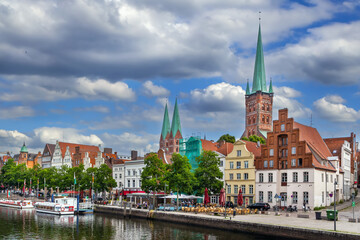 Fototapeta premium Historic houses on the Trave River embankment in Lubeck, Germany