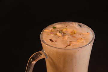 Top Angle View of Custard Milkshake with Chopped Pistachios on Top in Dark Background — Delicious Dessert Beverage Concept