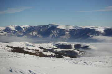 Winter landscapes of the old mountain. Stara Planina Ski Center in winter, ski slopes, clear blue sky above the snowy peaks of Stara Planina 