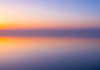 Fototapeta premium Peaceful expanse where the sky kisses the sea at sundown horizon