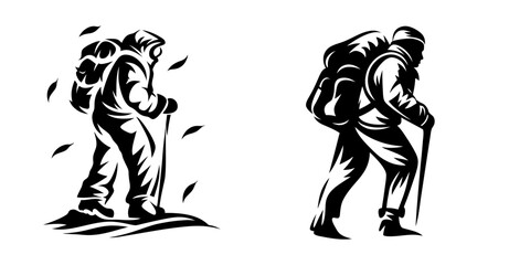 Fototapeta premium Two silhouette hikers with backpacks and trekking poles capturing autumn adventure and outdoor exploration