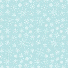 Snowy winter seamless pattern of hand drawn snow flakes on light blue background