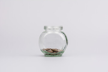 Saving coins in a piggy bank and financial investments, working to earn money, financial income and cash flow