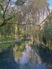 Scenic and relaxing view of the river among the willows in the Salvi Gardens in Vicenza