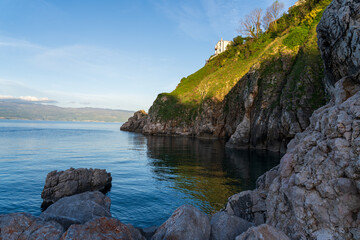 KRK Island, Vrbnik, Croatia - April 19, 2025: Panorama of mountains and water. Beautiful mountain horizon with cliffs and sea.